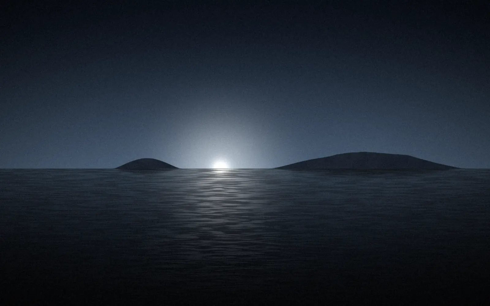 The sea at blue hour, a low island on the horizon